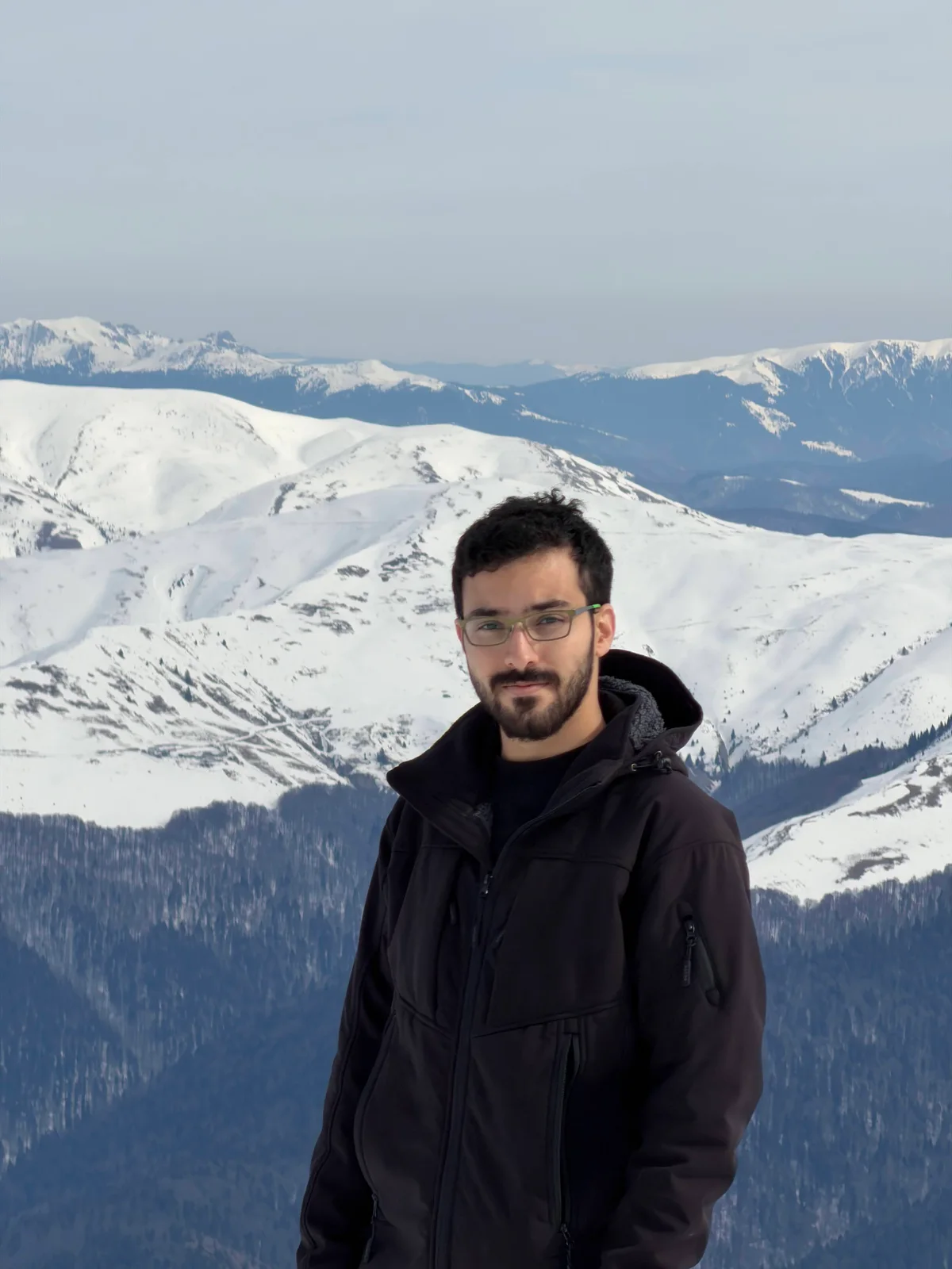 Dvir Ben-David with snow-covered mountains in the background